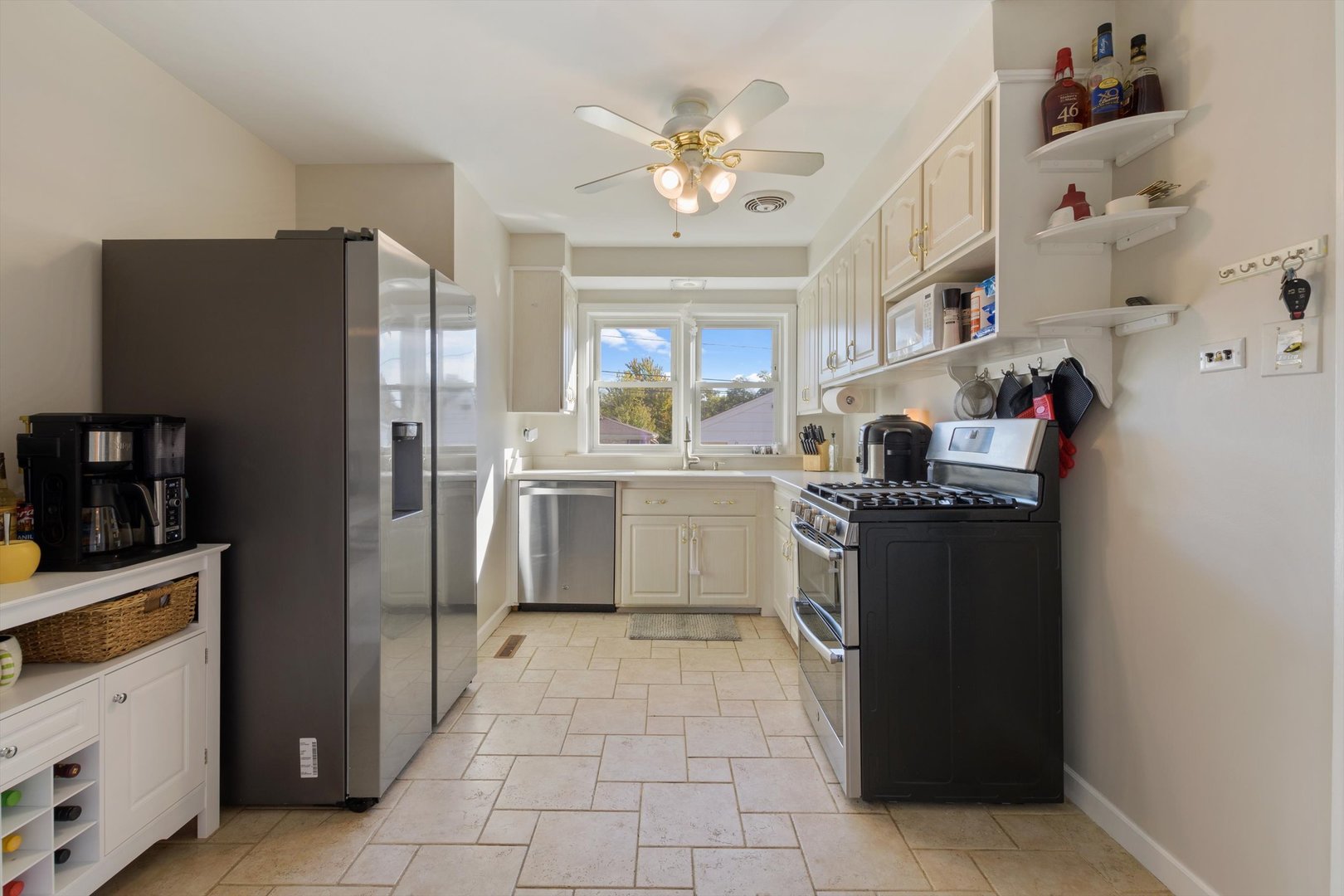 8151 Washington Street Niles, IL 60714 - Photo 7 of 18 a kitchen with stainless steel appliances granite countertop a refrigerator and a sink