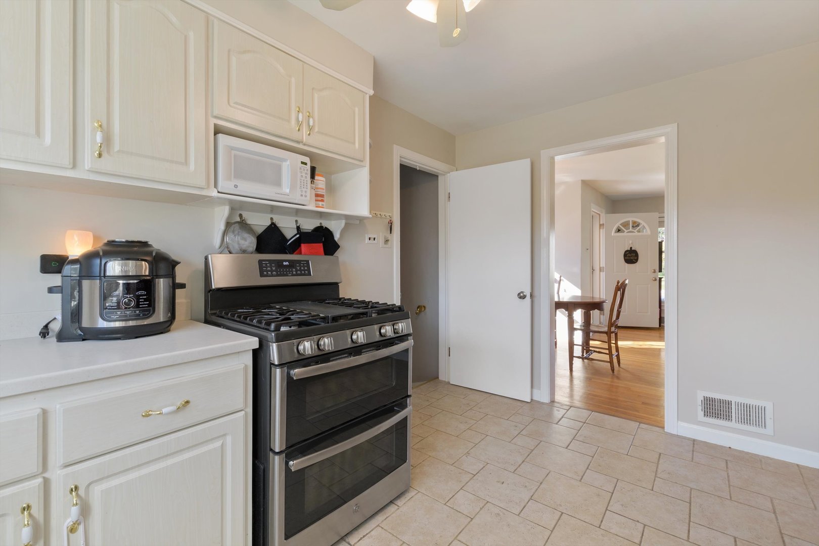8151 Washington Street Niles, IL 60714 - Photo 8 of 18 a kitchen with cabinets and appliances