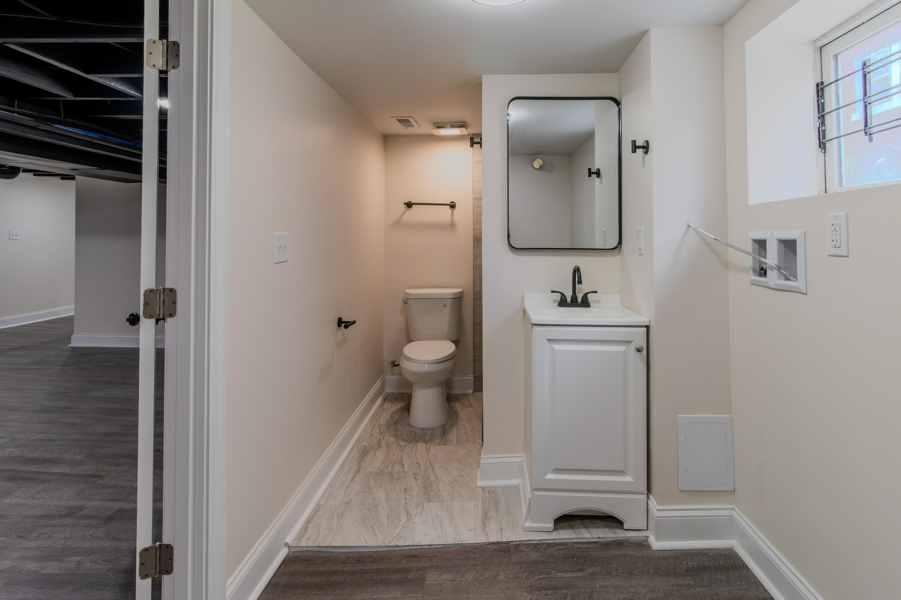 3678 Jackson Street Gary, IN 46408 - Photo 19 of 27 a bathroom with a toilet sink and mirror