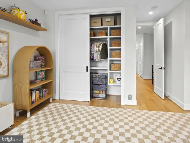 a view of a room with window and a bed