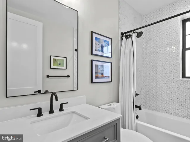 a view of a hallway with a shower