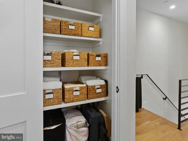 a bedroom with a bed and hallway