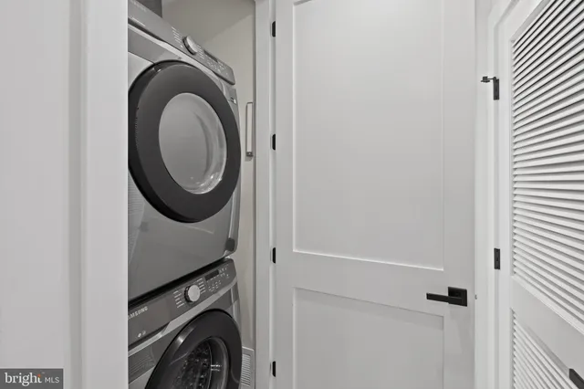 a kitchen with a stove a sink and a refrigerator