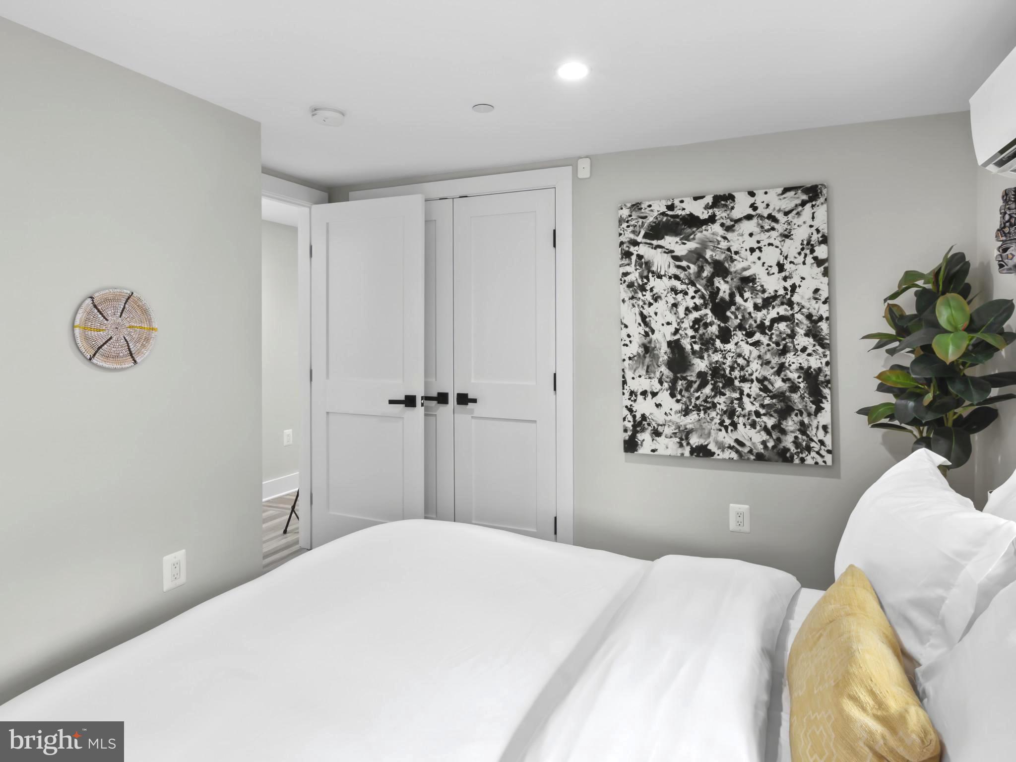 910 8th Street Northeast Washington, DC 20002 - Photo 43 of 54 a bedroom with a bed and a window