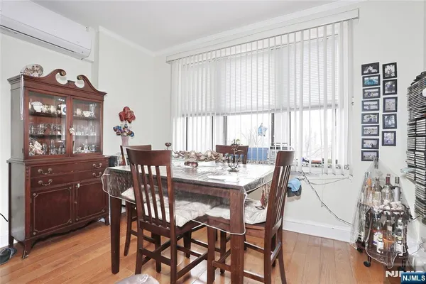 a view of a dining room with furniture and window