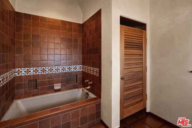 a view of a balcony with wooden floor