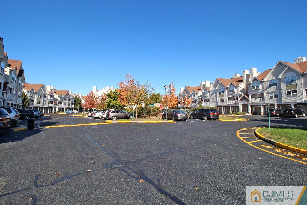 37 Inverness Drive Edison, NJ 08820 - Photo 2 of 25 a view of a street with a cars park in front of it