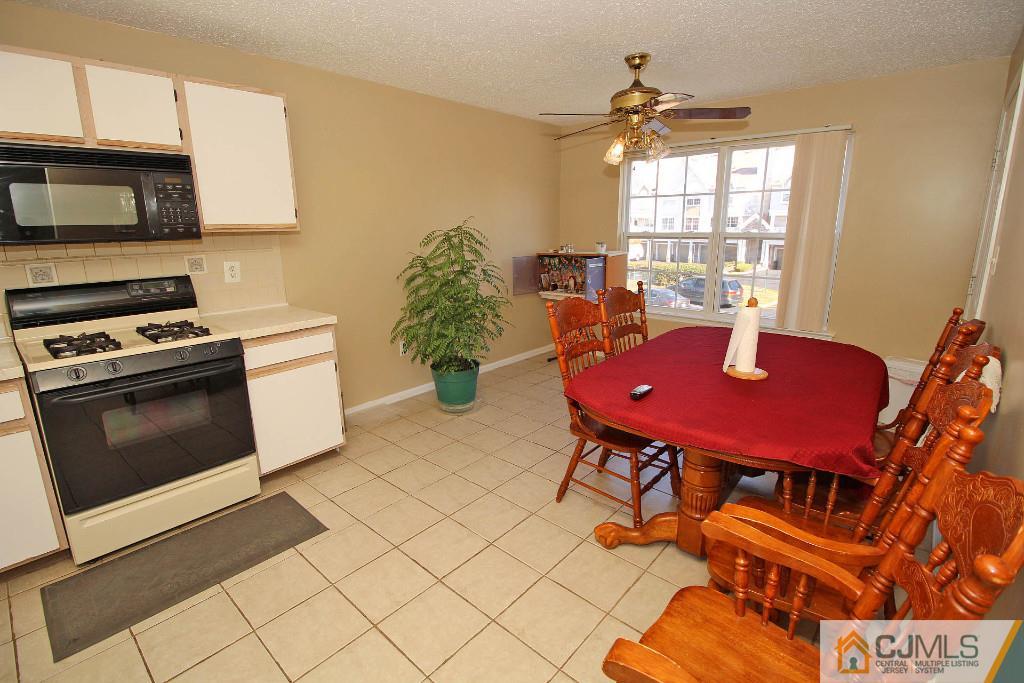 37 Inverness Drive Edison, NJ 08820 - Photo 11 of 25 a view of a dining room with furniture window and outside view