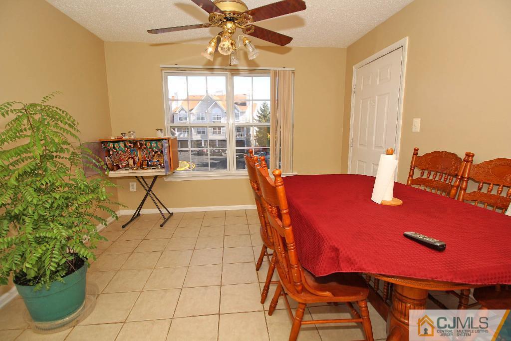 37 Inverness Drive Edison, NJ 08820 - Photo 12 of 25 a view of a dining room with furniture and chandelier