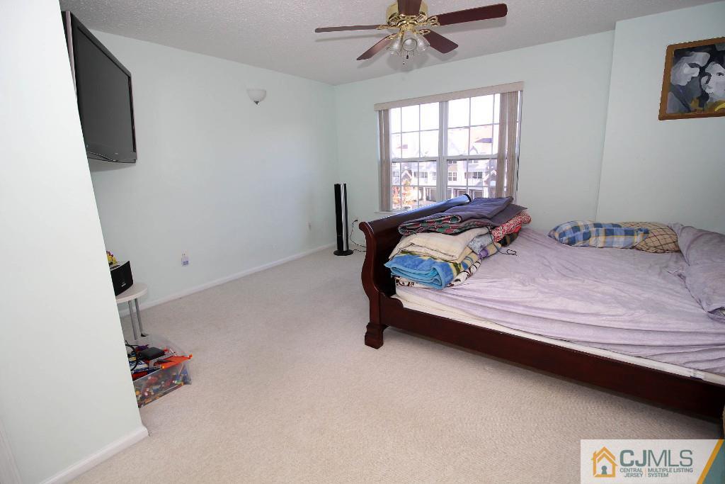 37 Inverness Drive Edison, NJ 08820 - Photo 17 of 25 a bedroom with a bed and a window