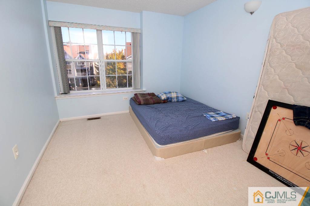 37 Inverness Drive Edison, NJ 08820 - Photo 21 of 25 a room with a bed and a window