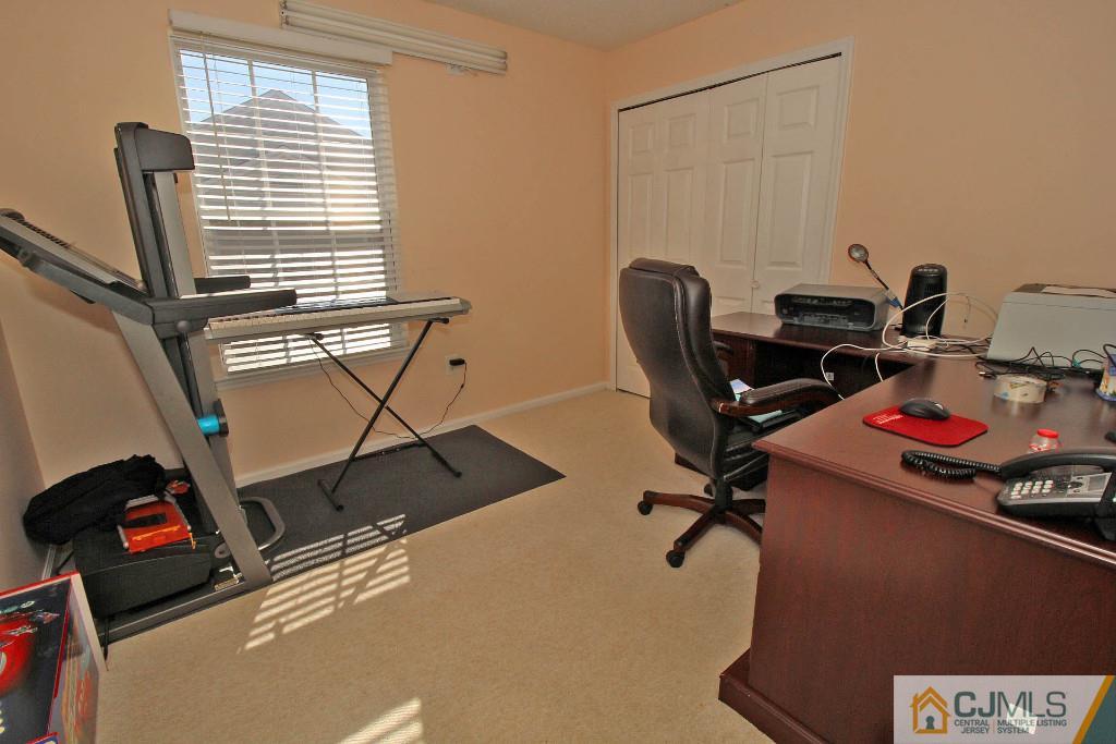 37 Inverness Drive Edison, NJ 08820 - Photo 22 of 25 a view of a workspace with furniture and a window