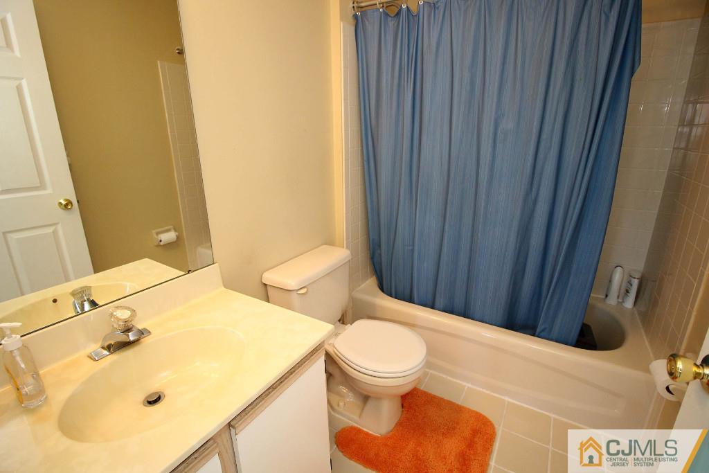 37 Inverness Drive Edison, NJ 08820 - Photo 23 of 25 a bathroom with a sink and toilet