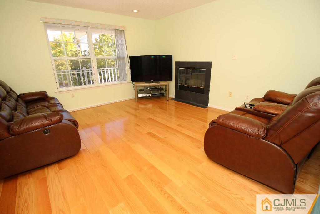 37 Inverness Drive Edison, NJ 08820 - Photo 8 of 25 a living room with furniture and a flat screen tv