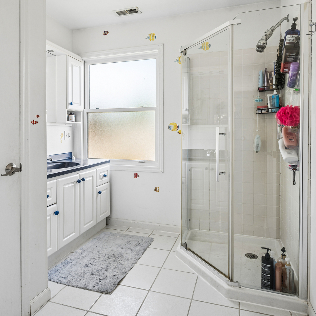 8330 Gross Point Road Morton Grove, IL 60053 - Photo 15 of 22 a bathroom with a shower