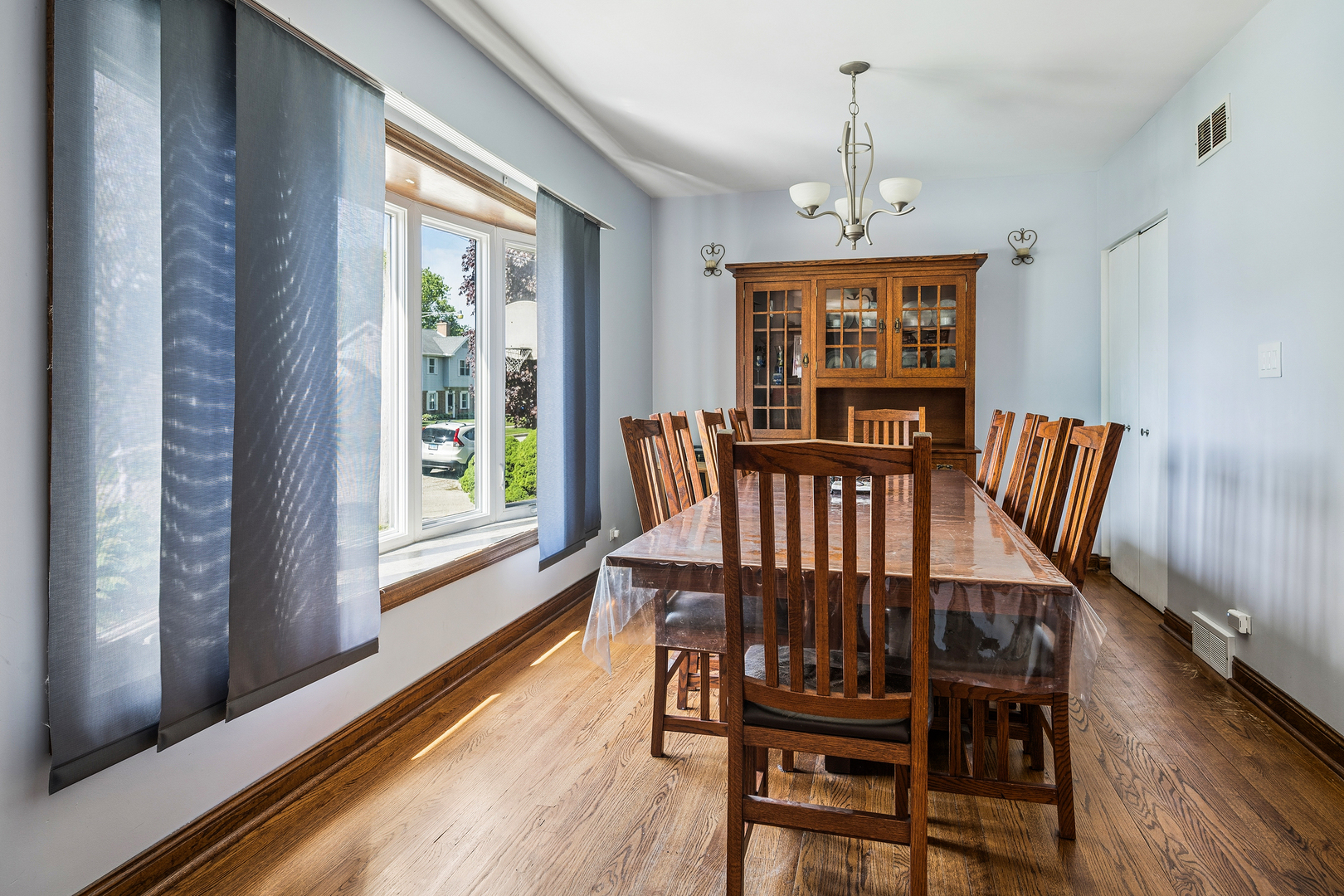8330 Gross Point Road Morton Grove, IL 60053 - Photo 8 of 22 a view of a dining room with furniture window and wooden floor
