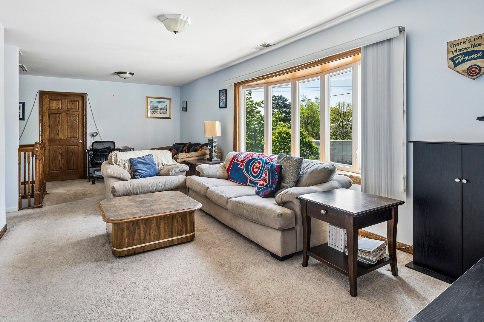 8330 Gross Point Road Morton Grove, IL 60053 - Photo 10 of 22 a living room with furniture and a large window