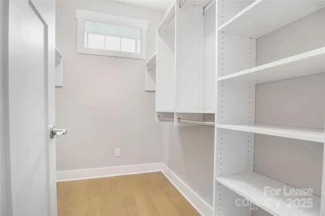 a view of an empty walk in closet