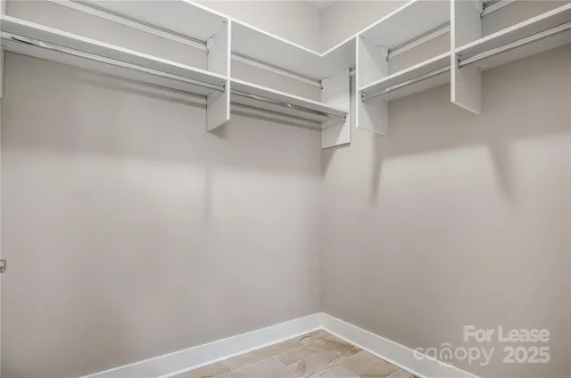 a view of an empty walk in closet