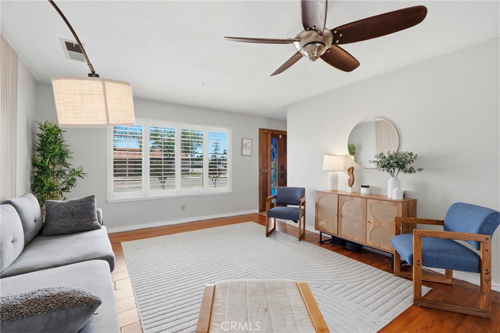 1237 South Clover Street Visalia, CA 93277 - Photo 11 of 30 a living room with furniture and a large window