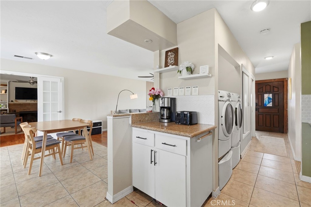 1237 South Clover Street Visalia, CA 93277 - Photo 16 of 30 a kitchen with cabinets and chairs