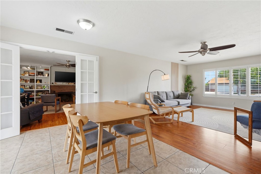 1237 South Clover Street Visalia, CA 93277 - Photo 18 of 30 a view of a dining room with furniture window and wooden floor