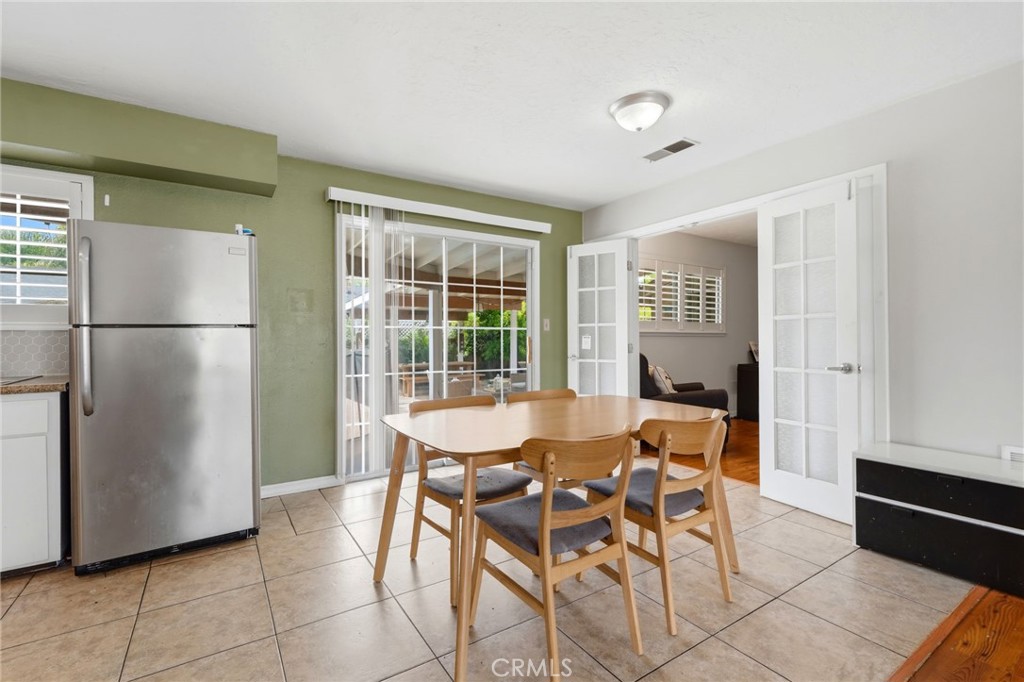 1237 South Clover Street Visalia, CA 93277 - Photo 19 of 30 a view of a dining room with furniture window and outside view