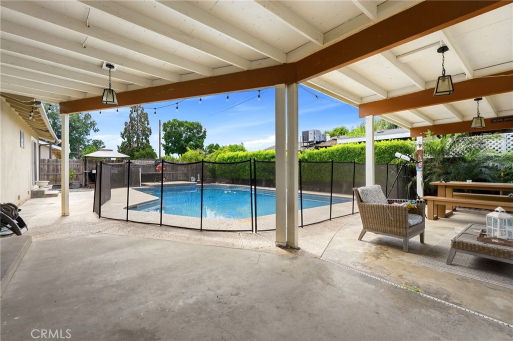 1237 South Clover Street Visalia, CA 93277 - Photo 24 of 30 a view of porch with furniture and a yard