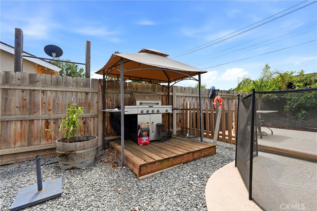 1237 South Clover Street Visalia, CA 93277 - Photo 27 of 30 a view of a chairs and table in backyard
