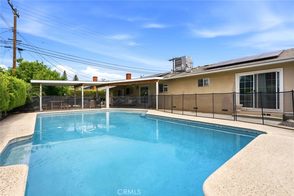 1237 South Clover Street Visalia, CA 93277 - Photo 30 of 30 a view of a house with a swimming pool