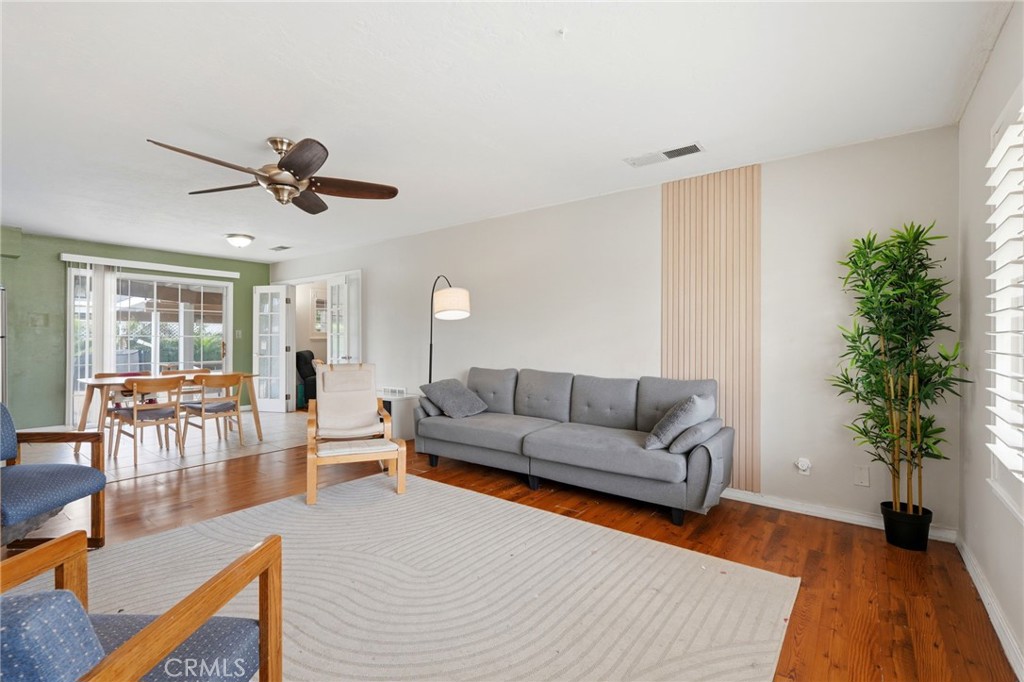 1237 South Clover Street Visalia, CA 93277 - Photo 8 of 30 a living room with furniture and a potted plant