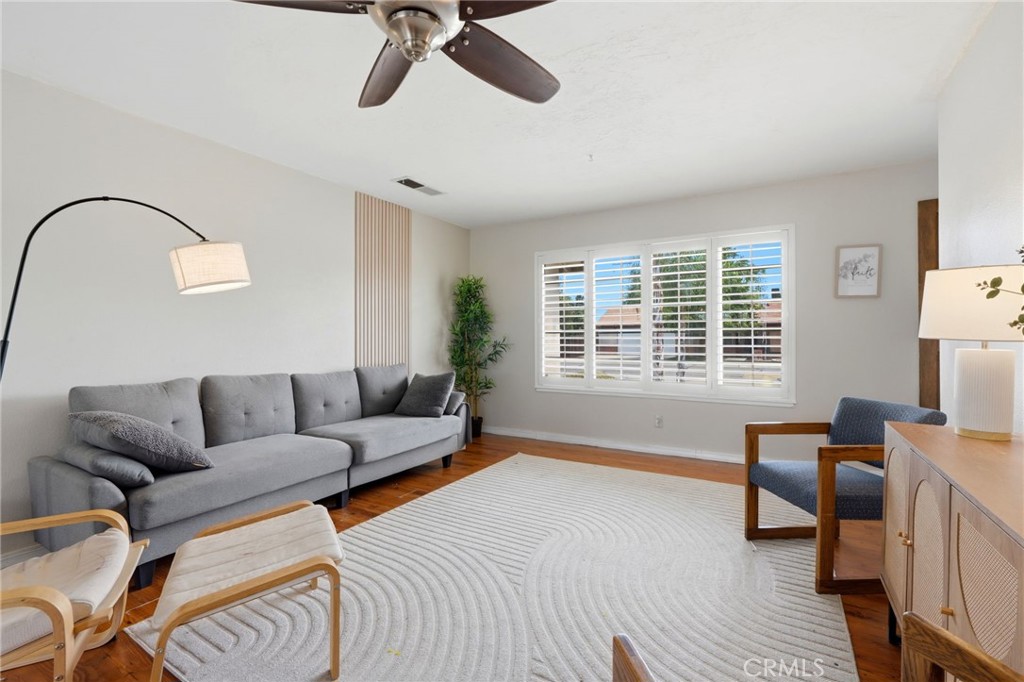 1237 South Clover Street Visalia, CA 93277 - Photo 10 of 30 a living room with furniture and a large window