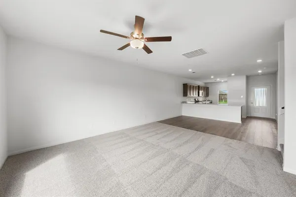 a view of a livingroom with a kitchen