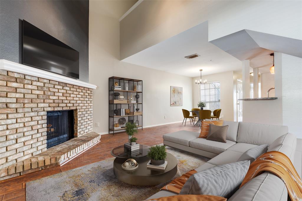 5565 Preston Oaks Road, Unit 237 Dallas, TX 75254 - Photo 2 of 14 a living room with furniture a flat screen tv and a fireplace
