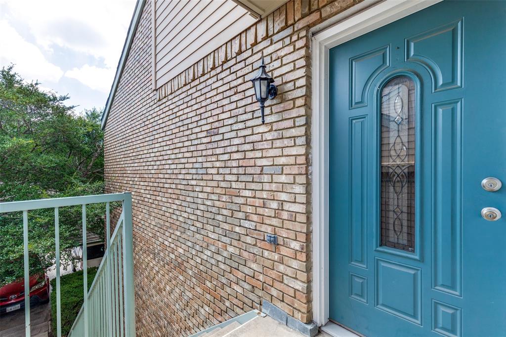 5565 Preston Oaks Road, Unit 237 Dallas, TX 75254 - Photo 3 of 14 a view of a house with a porch