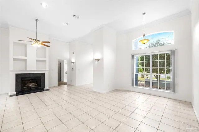 a view of an empty room with a fireplace