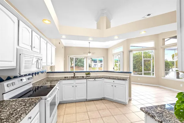 a kitchen with stainless steel appliances a refrigerator and a stove top oven