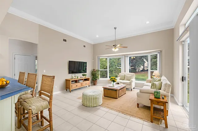 a kitchen with white cabinets and refrigerator