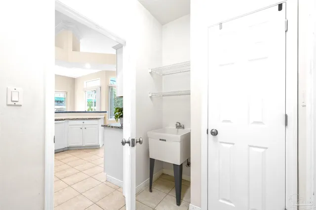 a view of a bedroom with a window and a hardwood floor
