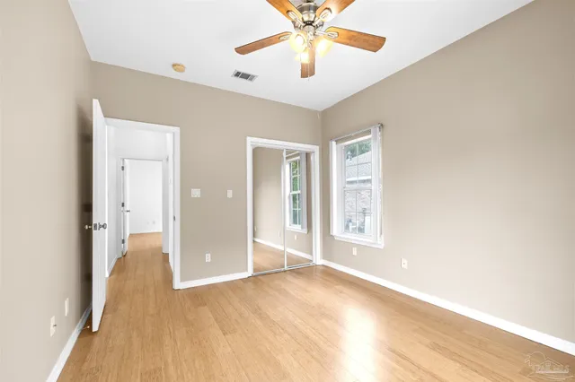 an aerial view of a house with a yard and garden