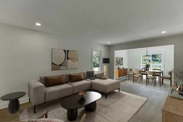 a large kitchen with stainless steel appliances granite countertop a lot of counter space and wooden floor