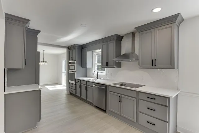 a bath tub sitting in a bathroom next to a window