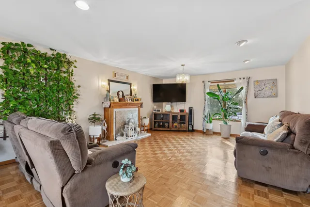 a living room with furniture and a fireplace