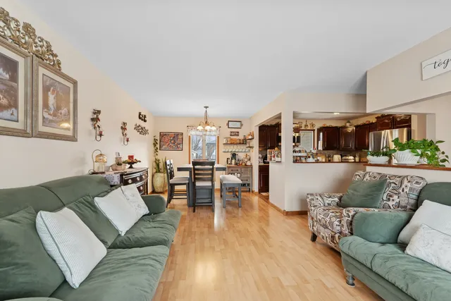 a kitchen with stainless steel appliances granite countertop a refrigerator a stove top oven a sink and dishwasher