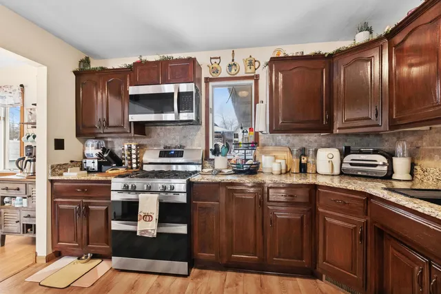 a bedroom with a bed window and a lamp