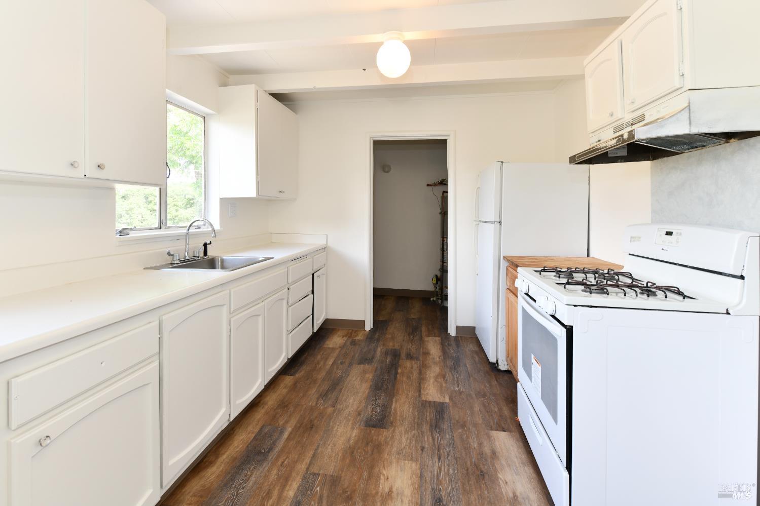 1577 Silverado Trail Napa, CA 94559 - Photo 18 of 30 a kitchen with sink a stove and a refrigerator