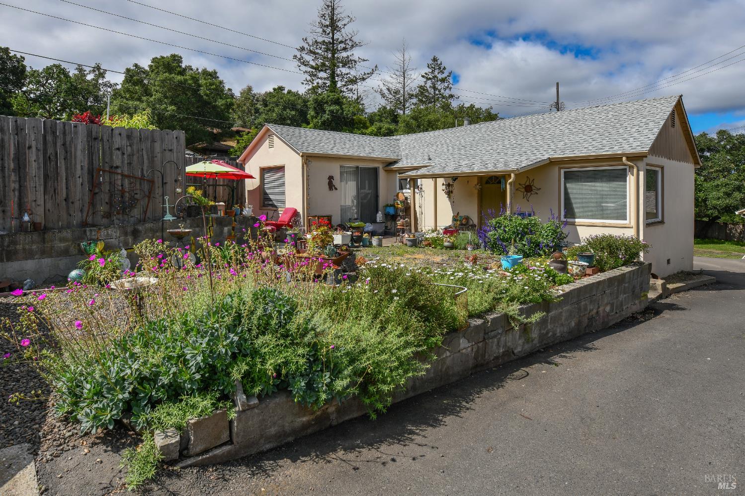 1577 Silverado Trail Napa, CA 94559 - Photo 6 of 30 a view of a house with a small yard and potted plants