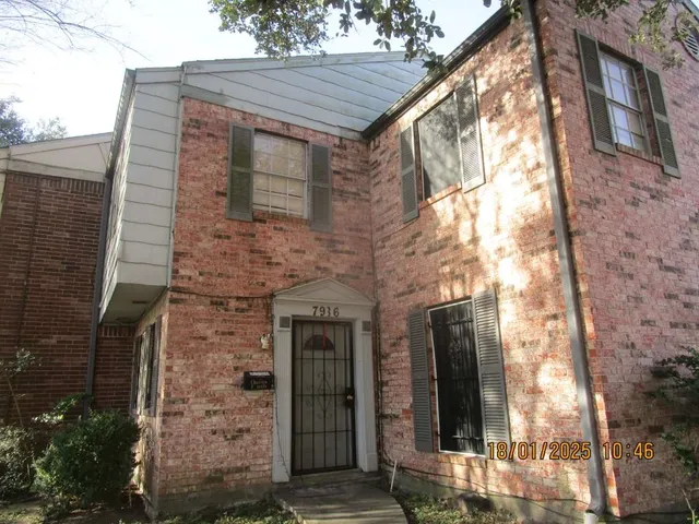 a brick building with a large windows
