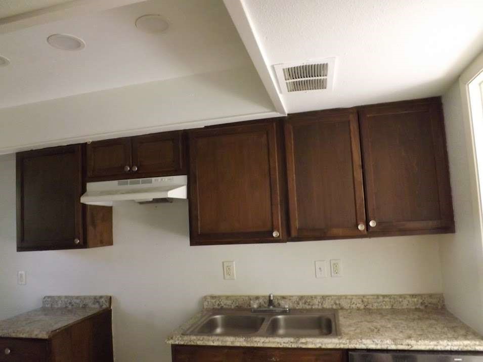 7936 Grove Ridge Drive Houston, TX 77061 - Photo 4 of 11 a kitchen with a sink and cabinets