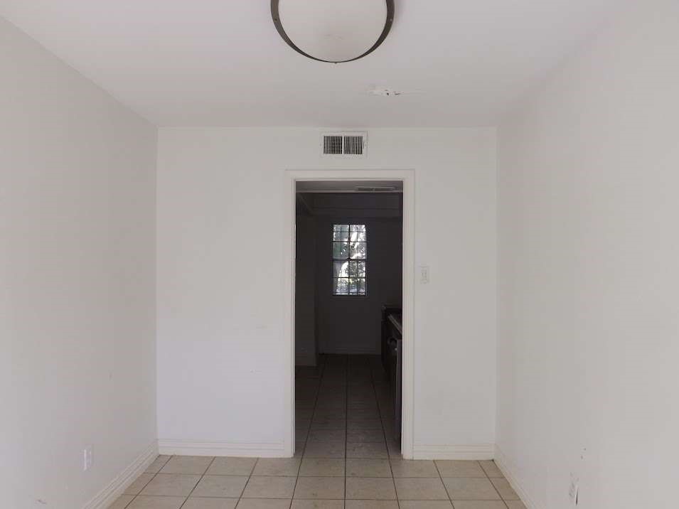 7936 Grove Ridge Drive Houston, TX 77061 - Photo 5 of 11 a front view of a house with entryway